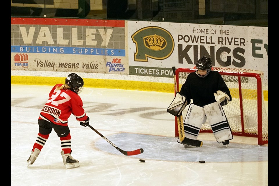 PUCK HANDLING: Going for goal during a hockey practice is one of the more than 50 participants registered for the Powell River Minor Hockey Association all girls developmental program for young players.                               