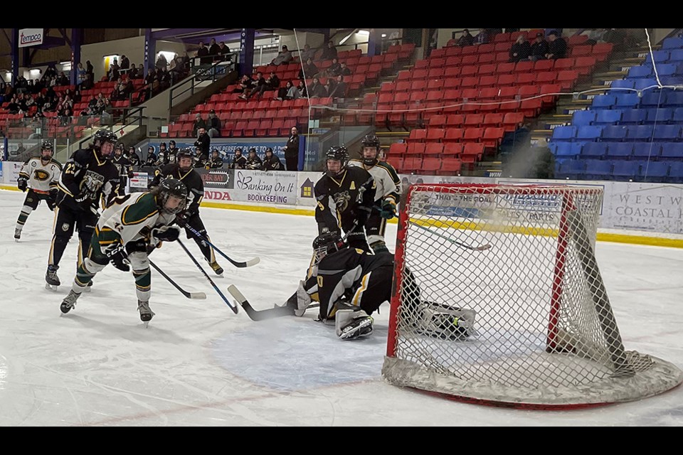 Powell River U15 Kings' players descend upon the North Island (Tri-Port) Eagles' net looking for a rebound during a minor hockey playoff game at Hap Parker Arena on Saturday, February 25.