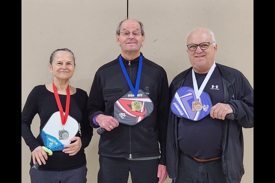 PODIUM PLACEMENT: [From left] Terry Baker, Jack Wiebe and Nick Farina reached the podium at a pickleball tournament earlier this month.