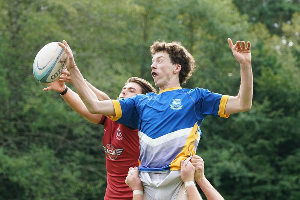 HIGH JUMP: Jumping for the ball in a line-out is Otago Rugby Club player Eli Forsyth [right], who is going up against a Comox Valley Kickers opponent. The Vancouver Island side was the BC division three champion, so Otago was facing an experienced opponent, but the Powell River team managed to score four trys in the hard-fought match.                               