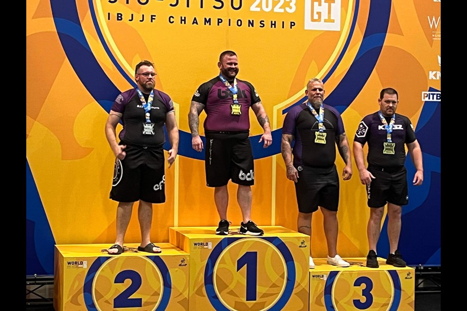 ATHLETIC ACHIEVEMENT: Greg Burton [left] was awarded a brown belt by his professor, Donavin Scott, after winning gold at the 2023 International Brazilian Jiu-Jitsu Federation World No-Gi Jiu-Jitsu Championship last week.
