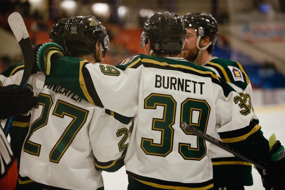 Powell River Regals' players [from left] Hunter Findlater, Cory Burnett and Gabe Shipley celebrate a goal against Nanaimo Steelmen at Hap Parker Arena on March 9.