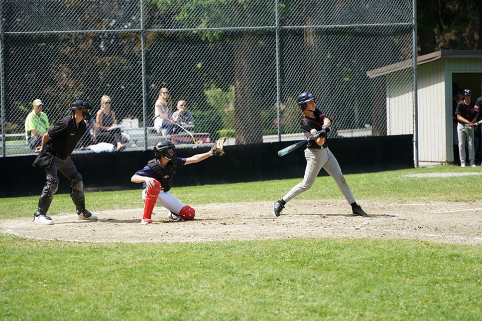 GROWING SPORT: Powell River Minor Baseball’s U15 player Tanner Ciarniello hits a pitch in a doubleheader played against Alberni Valley on June 14. Minor baseball is again thriving in the community, with a summer league keeping local players busy.                              