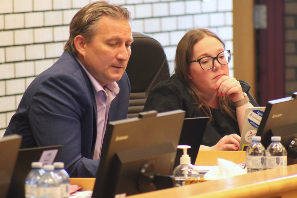 Prince George director of finance and IT services Kris Dalio (left) discusses the city's 2024 Annual Report at the Monday, June 23, 2025 council meeting as Coun. Cori Ramsay (right) looks on.