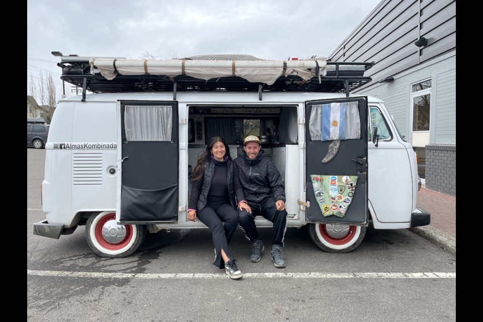 Carolina Gastiazoro and Facundo Arias show off the 1989 Volkswagen Kombi that has taken them across the Americas after arriving in Prince George on Tuesday, April 22, 2025.