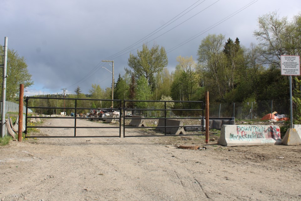 A locked gate bars traffic access to the western end of Moccasin Flats on Lower Patricia Boulevard after City of Prince George staff installed it on Thursday, May 8, 2025.