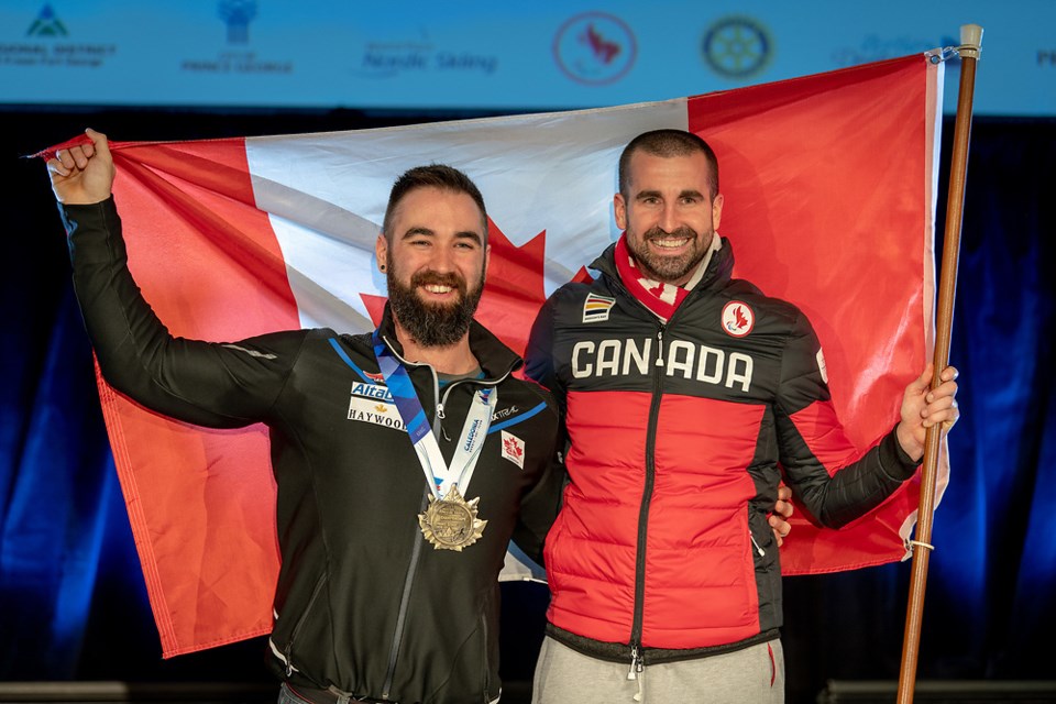 Collin Cameron (left) celebrates his gold medal with his Canadian coach at the 2019 World Para Nordic Skiing Championships in Prince George (via Kelly Bergman)