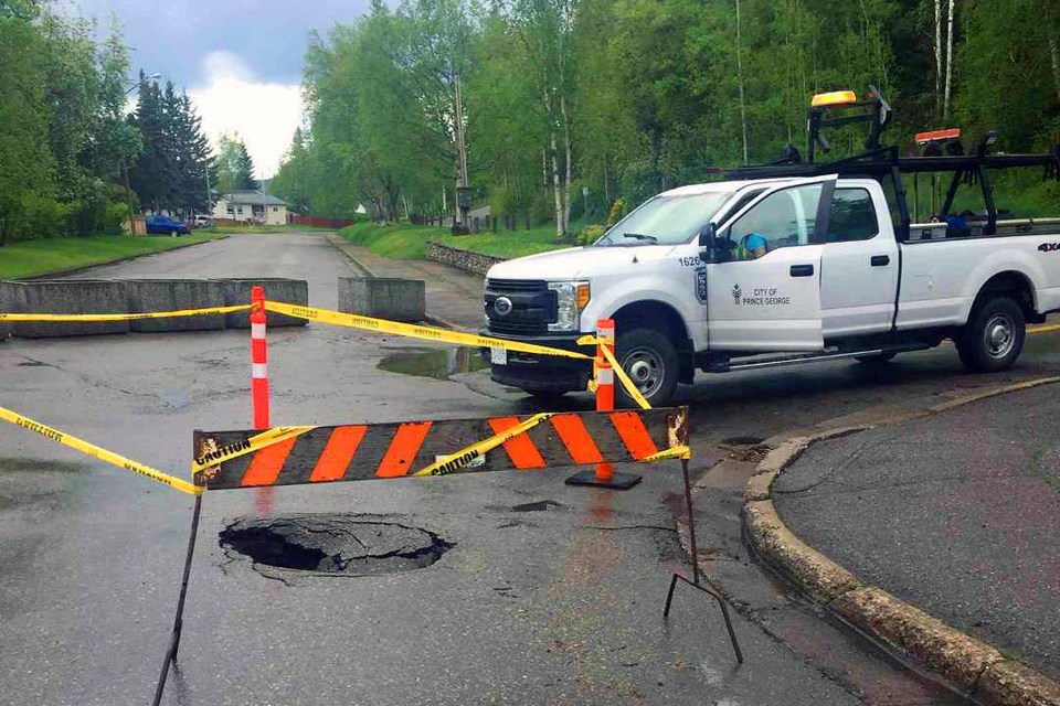 Sinkhole seen in photo is prohibiting vehicle traffic to the entrance of Connaught Hill Park (via City of Prince George)