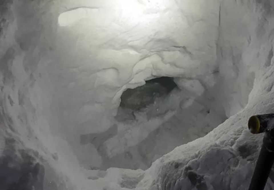 snowmobiler snow cave