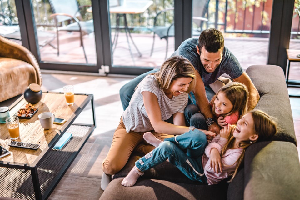 Family chuckling - Getty Images
