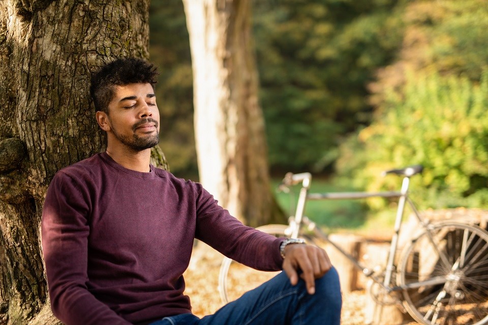 Man breathing in nature - Getty Images