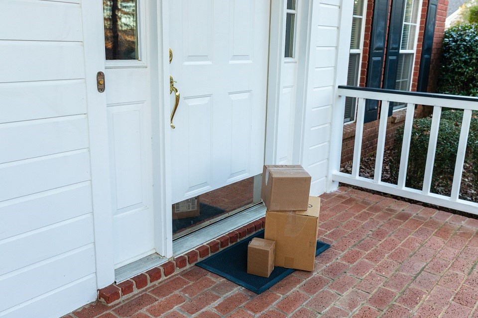 Porch pirate thief packages delivery home - Getty Images