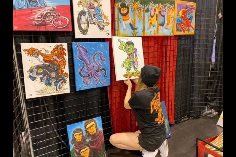 Prince George's Hanna Minck hangs up her artwork in collaboration with skateboarding legend Steve Caballero at DesignCon in Anaheim, Cali. (via Submitted)