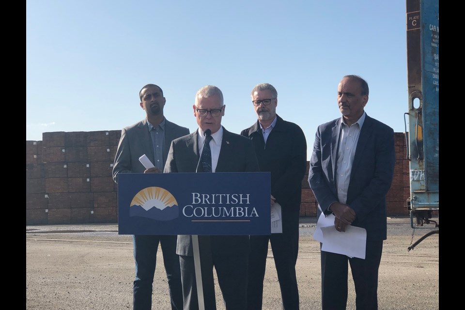 B.C. Forests Minister Doug Donaldson (second from the left) at Prince George's CN Railyard. (via Hanna Petersen)