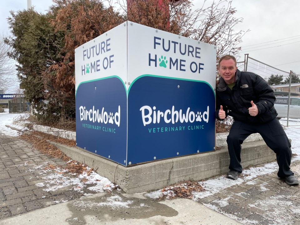 Dr. Bauman with Birchwood sign