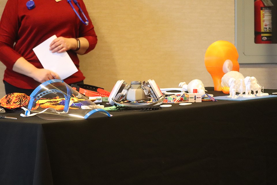 Dr. Malgorzata Kaminska demonstrates the equipment the group has been producing. (via Hanna Petersen) 