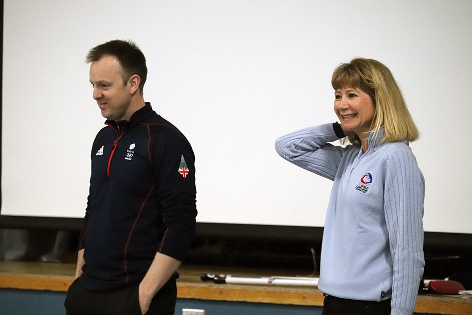 Students from Prince George's Harwin Elementary were familiarized with the sport of curling with help from Canada's Karri Willms (right) and Scotland's Tom Brewster. (via Kyle Balzer)