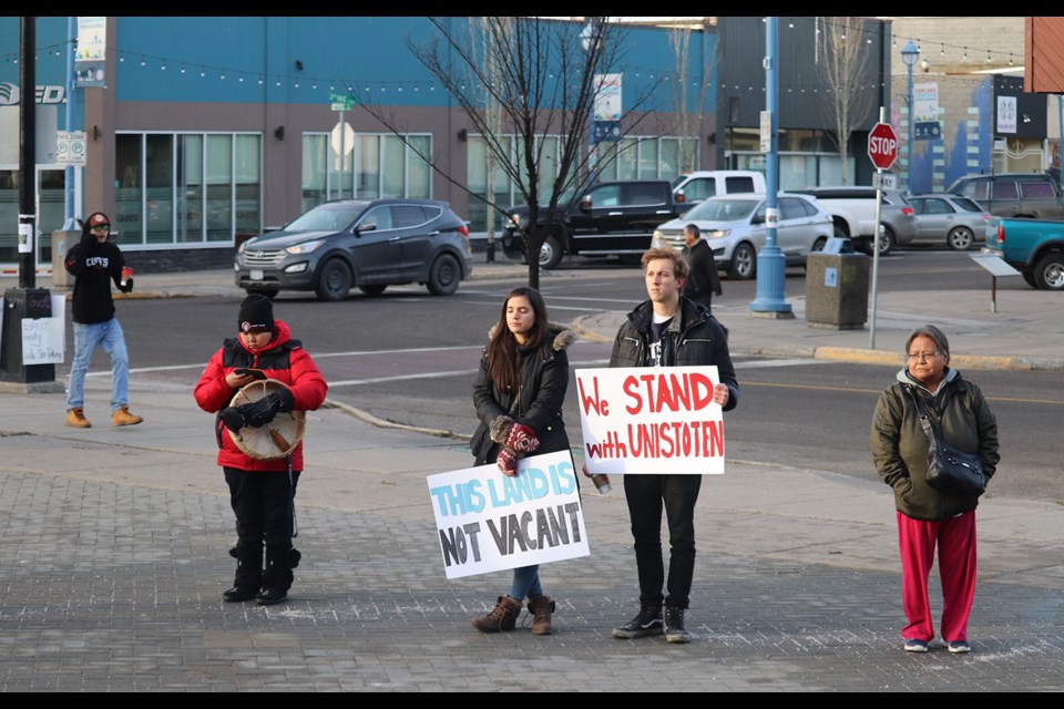 Supporters of the camp stand in the cold and dry December air as the sounds of drums and smell of burning sage resonated throughout. (via Jordan Tucker)