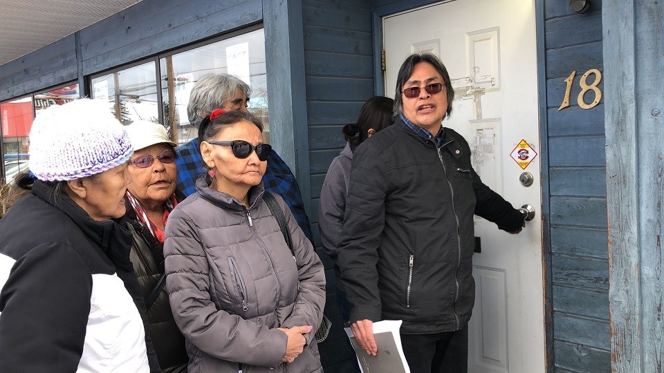 Mathew Joseph, who claims he's still the Chief of Yekooche First Nation, tries to open the door to the band's financial office in Prince George, but its locked (via Kyle Balzer)
