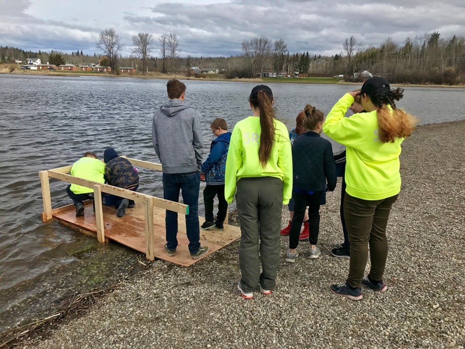 Nechako release - Kids lined up to release