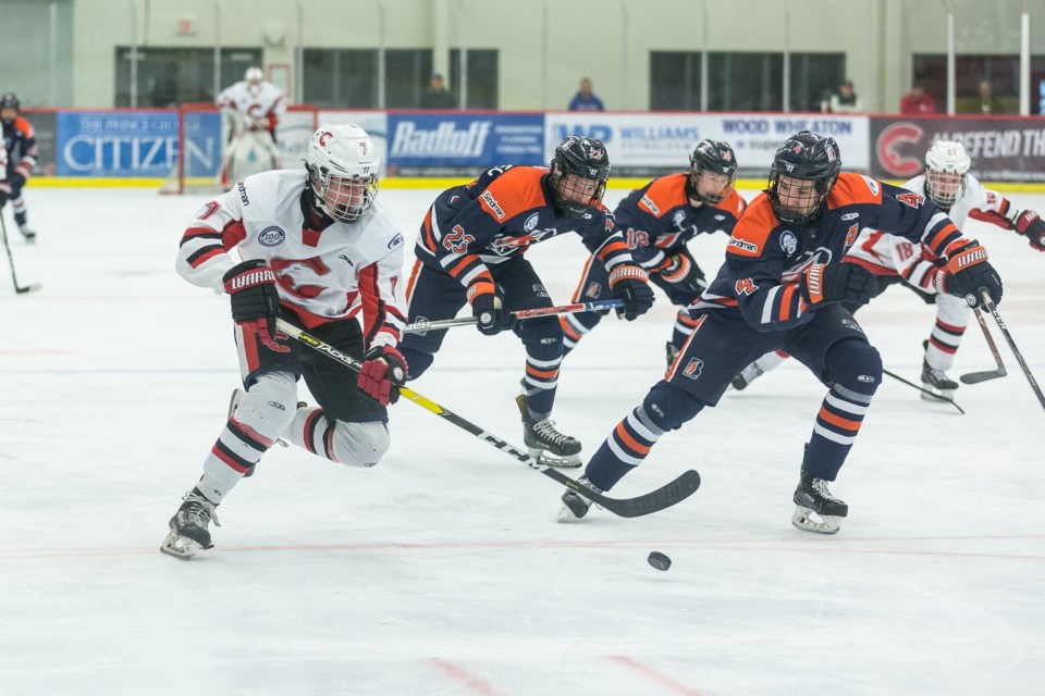 Booker Daniel (#7) races with the puck against the Thompson Blazers at the Kin Centre (via Facebook/Cariboo Cougars)