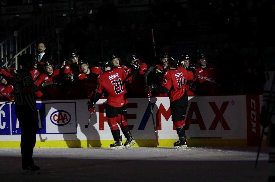 Connor Bowie (#21) leads the goal celebration line for the Prince George Cougars during a home game against Kamloops Blazers (via Chuck Chin Photography)