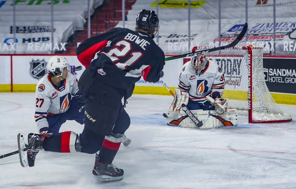 Prince George Cougars' Connor Bowie (#21) takes a shot towards the Kamloops Blazers net during the 2020-21 B.C. Division season.
