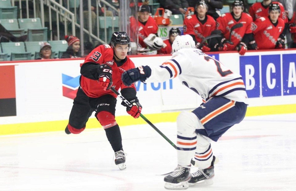 Filip Koffer (#23) tries to make a pass for the Prince George Cougars against Kamloops on home ice (via Chuck Chin Photography)