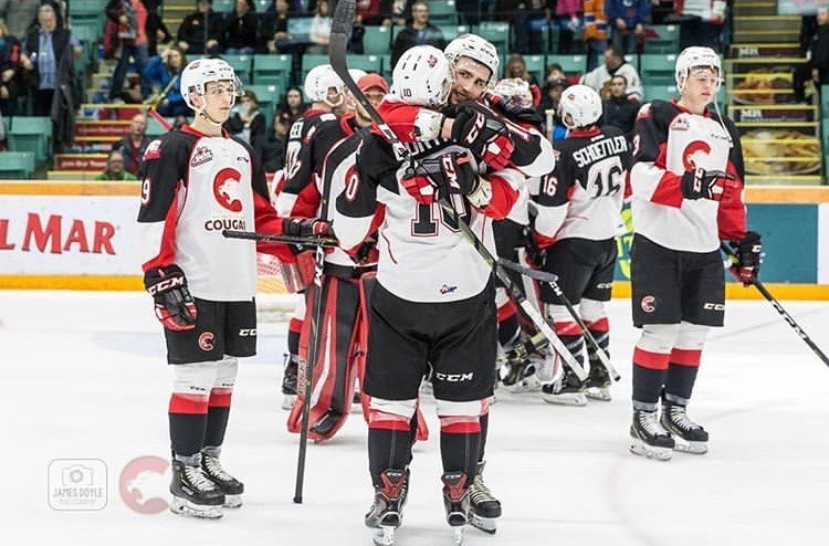 Cougars hug each other after the final buzzer of the last game of the 2018-19 season against the Kamloops Blazers (via Prince George Cougars/James Doyle Photography)