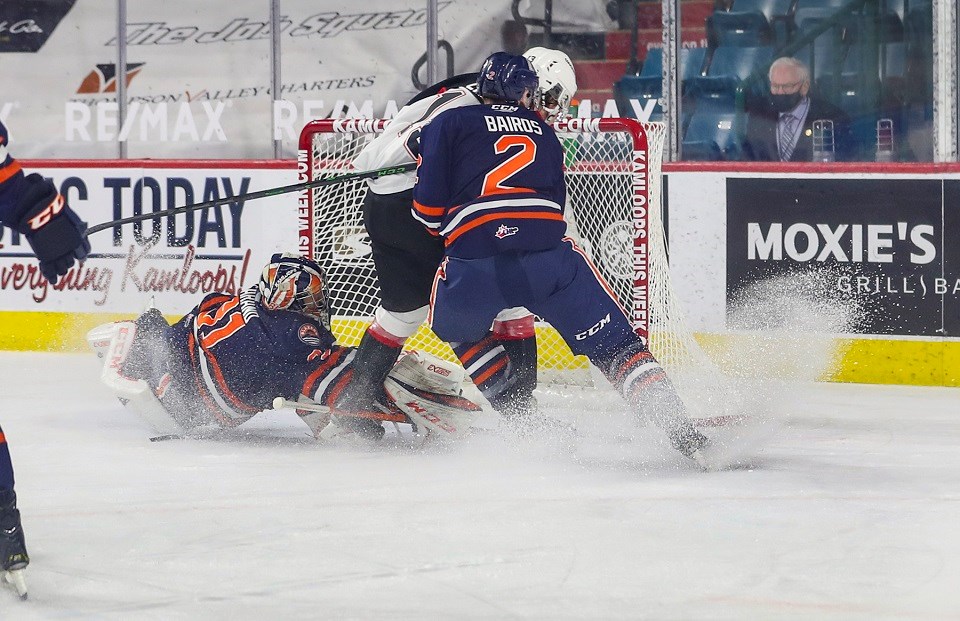 Prince George Cougars' Koehn Ziemmer (#13) finishes a partial breakaway against Kamloops to score his first career WHL goal in the 2020-21 B.C. Division season opener.