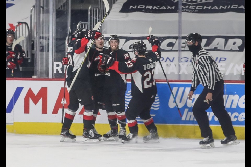 Prince George Cougars celebrate a goal from Jonny Hooker (#18) during the 2020-21 B.C. Division season.