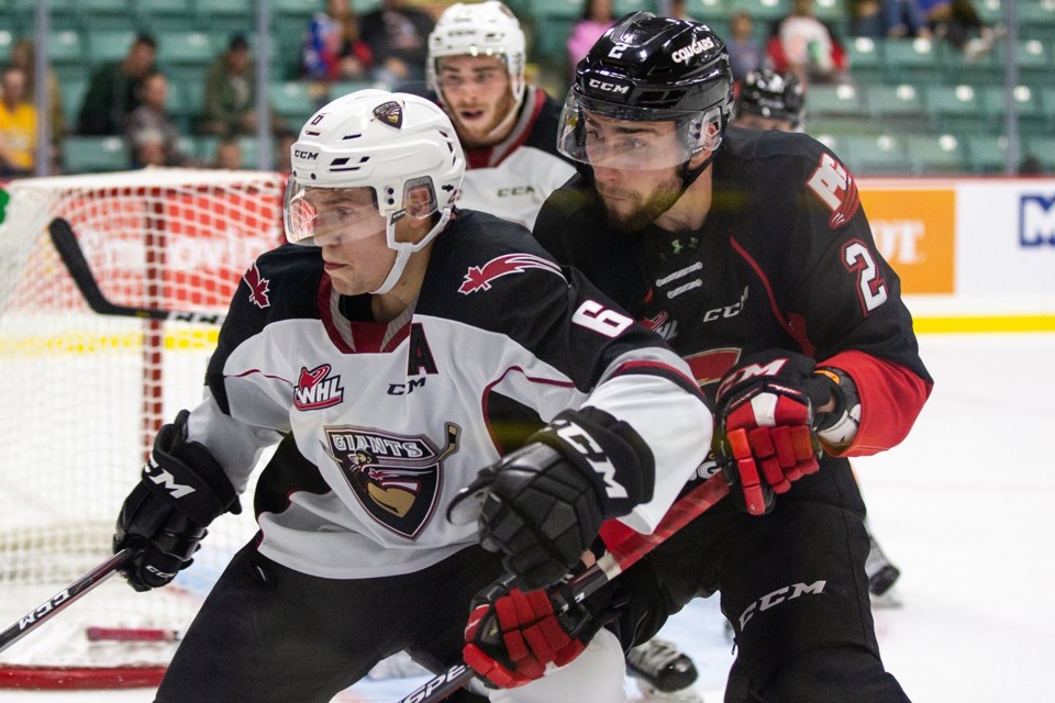 Cole Moberg (#2) up against a Vancouver Giants' defender at the CN Centre (via Prince George Cougars/Brett Cullen Photography)