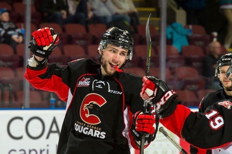 Cole Moberg (#2) celebrates a goal on the road for the Prince George Cougars. / Vancouver Giants/Rik Fedyck Photography