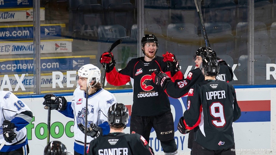 Prince George Cougars' Connor Bowie (#21) celebrates his hat-trick goal en route to a 5-3 win over Victoria.