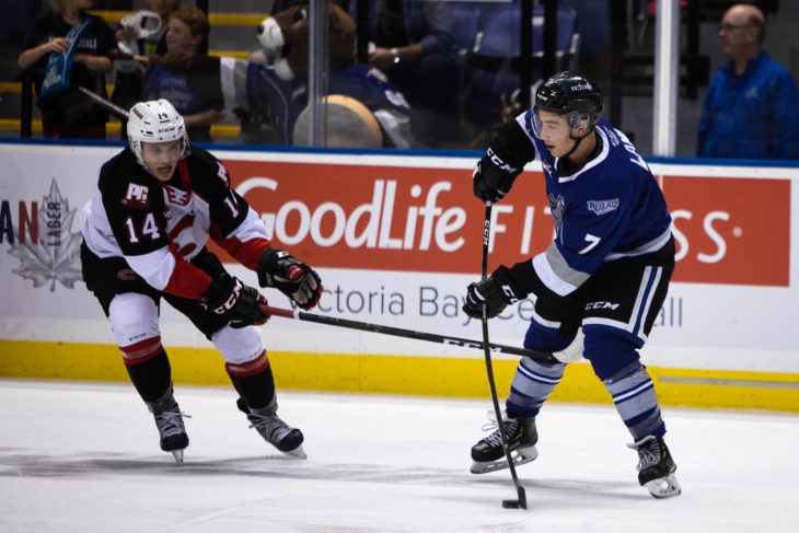 Prince George Cougars' Brendan Boyle (#14) tries to poke-check the puck away from the Victoria Royals (via Jay Wallace Photography)