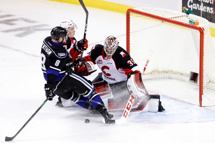 Prince George Cougars goaltender Taylor Gauthier (#35) gets a slight snow shower after stopping the puck on the road against he Victoria Royals (via Jay Wallace Photography)