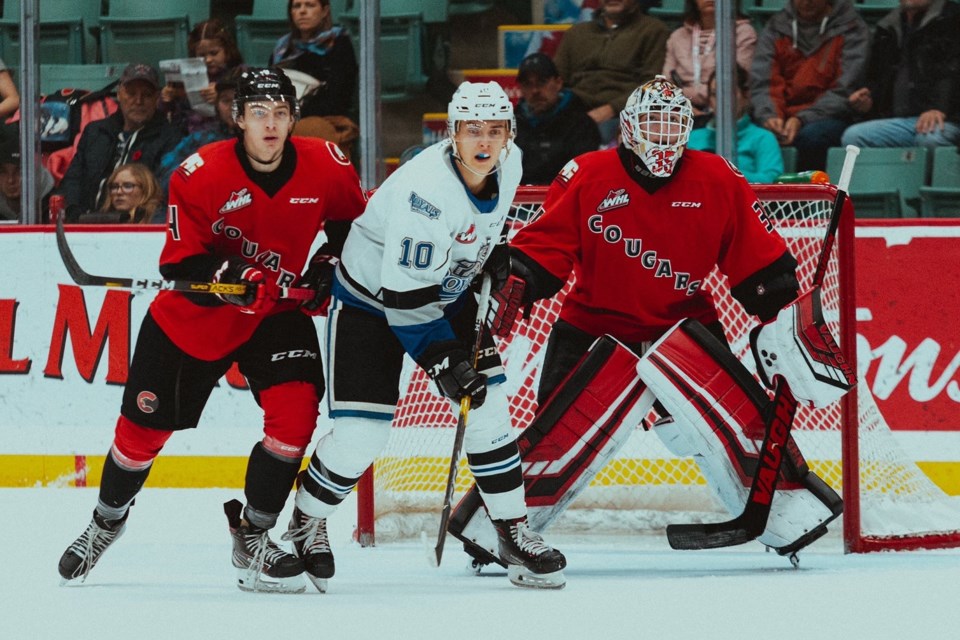 Taylor Gauthier (#35) and Ethan Samson (#4) keep an eye on the puck in their own zone against the Victoria Royals at the CN Centre (via Prince George Cougars/Brett Cullen Photography)