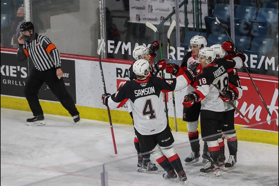 Prince George Cougars celebrate a goal from Jonny Hooker (#18) during the 2020-21 B.C. Division season.