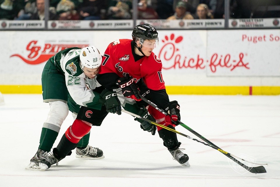 Prince George Cougars' Jack Sander (#17) keeps the puck away from a defender during a game on the road against the Everett Silvertips. | Chris Mast