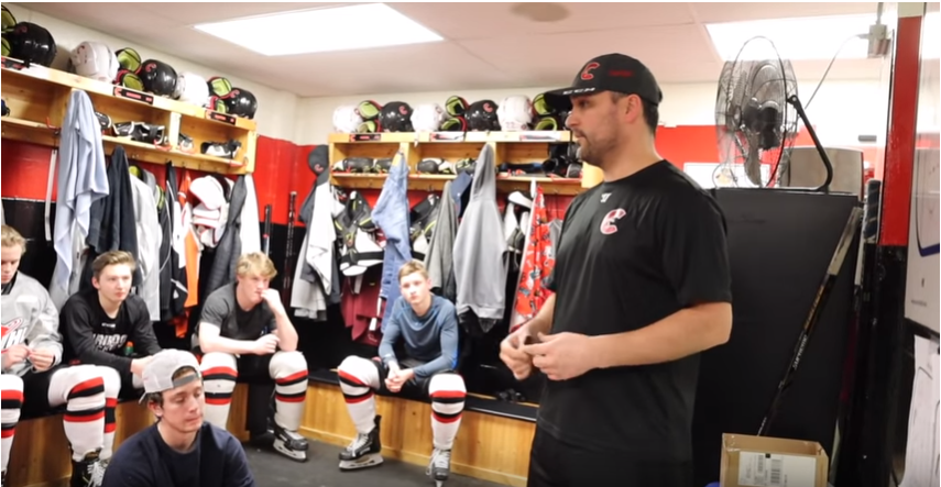 Cariboo Cougars Head Coach Tyler Brough talks with his team in the dressing room after a practice (via Marcus Allen)