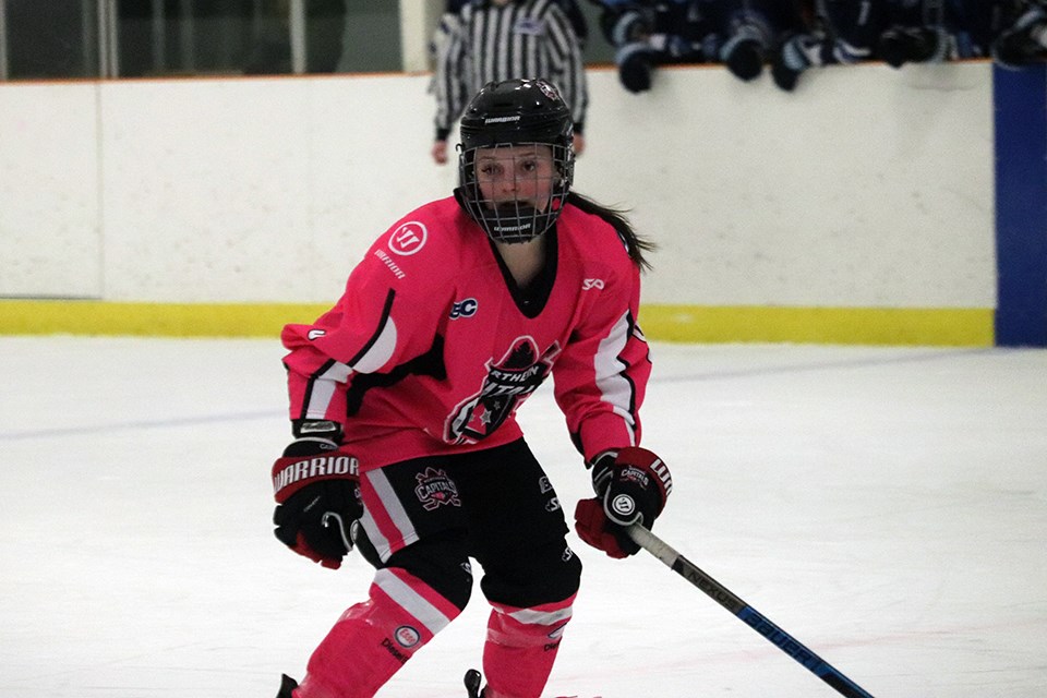 Pyper Alexander (#9) of the Northern Capitals eyes the puck against the Thompson-Okanagan Lakers (via Kyle Balzer)