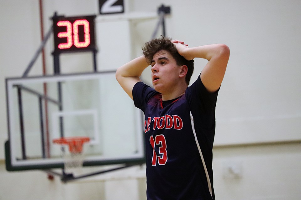 Cam Sale (#13) of the D.P. Todd Secondary Trojans catches his breath during the 2020 Prince George City Basketball Championship. (via Kyle Balzer)