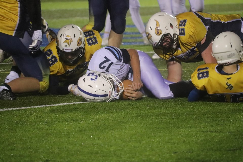 College Heights' Hayden Matheson (#12) is taken down by Nechako Valley in the 2019 B.C. High School Football Northern AA Sr. Varsity Conference final, known as the P.G. Bowl. | Kyle Balzer, PrinceGeorgeMatters