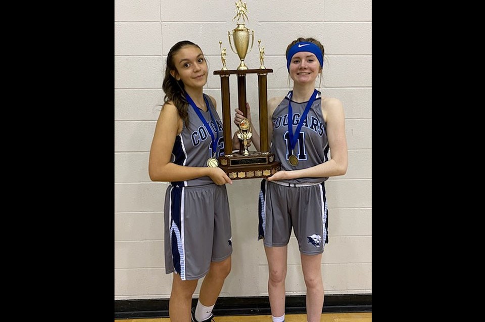 Rachel Loukes (right) helped the College Heights Cougars junior girls basketball team to the Prince George district and North Central Zone titles in February 2020.