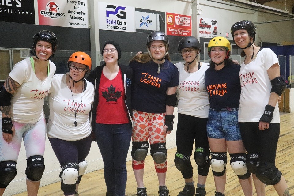 Prince George roller derby athletes Dael King-Smith (middle) and Taylor Robinson (2nd right) are joined by family, teammates and supporters (via Kyle Balzer)