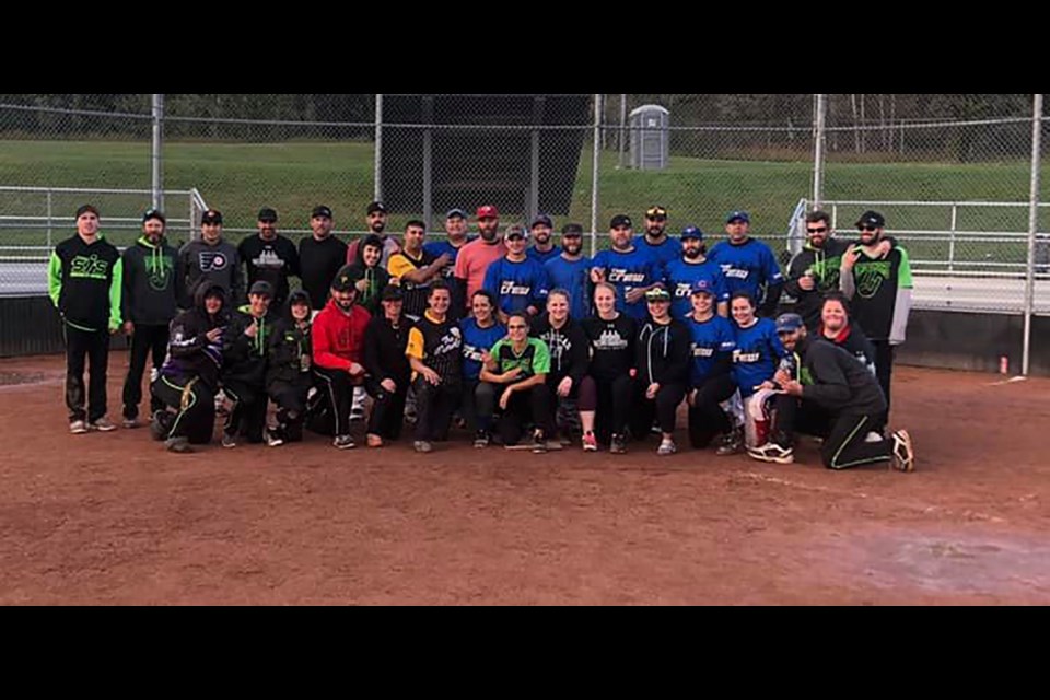 Prince George slo-pitch teams pose for a photo at the Fall Shocker charity tournament for pediatric care at the University Hospital of Northern B.C. (via Submitted)