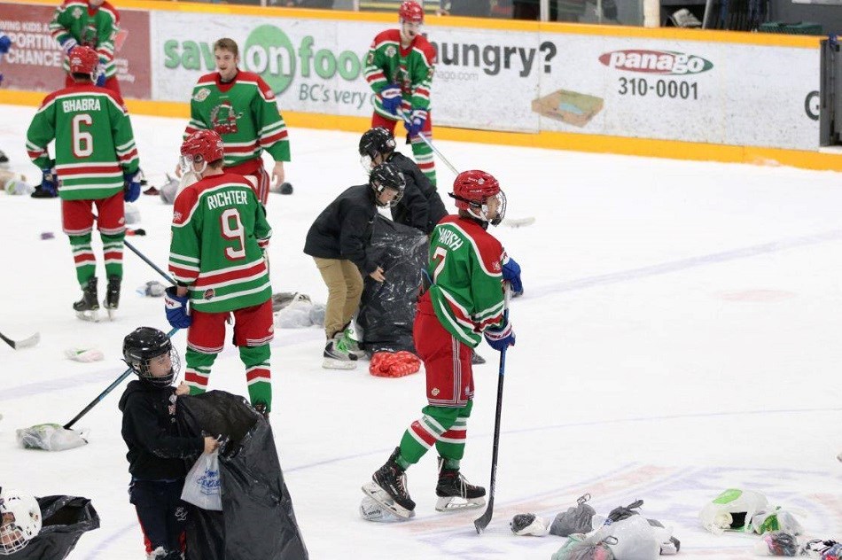 Prince George Spruce Kings clean up after scoring the Drop the Gloves, Sock it to 'Em goal against the Coquitlam Express (via Chuck Chin Photography)