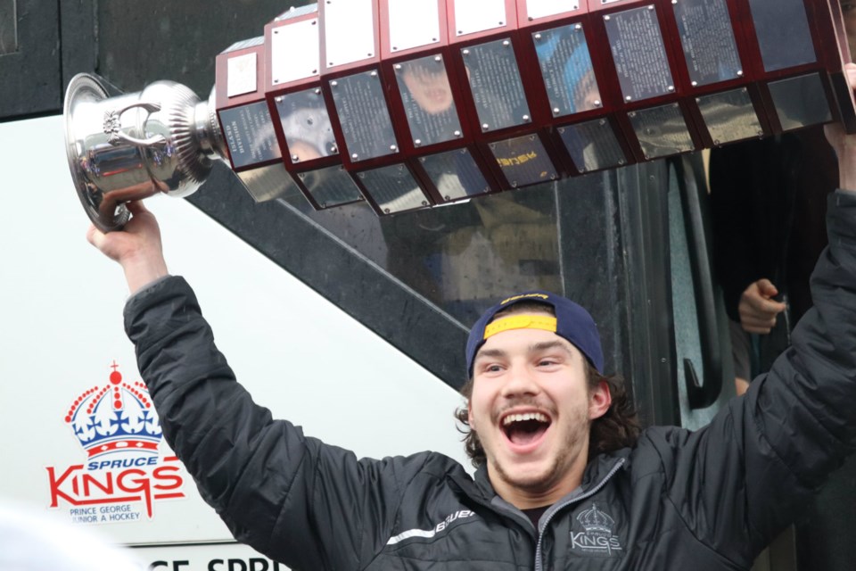 Prince George Spruce Kings Captain Ben Poisson enthusiastically shouts while stepping off the bus and lifting the Fred Page Cup (via Kyle Balzer)