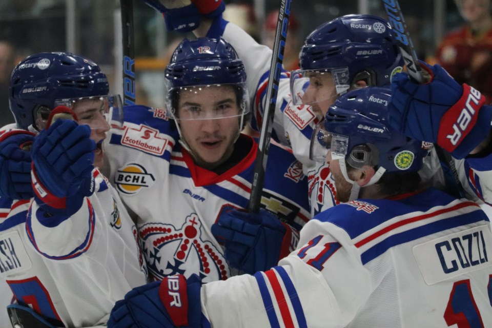 Prince George Spruce Kings Captain Ben Poisson (#12) is surrounded by teammates after scoring a playoff goal against the Chilliwack Chiefs (via Kyle Balzer)
