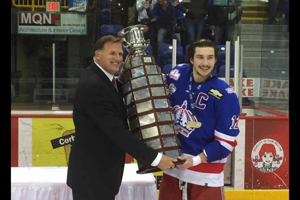 Prince George Spruce Kings captain Ben Poisson receives the Fred Page Cup from BCHL Commissioner Chris Hebb (via BCHL)